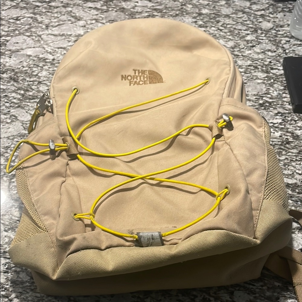 The North Face Beige Backpack with Yellow Accents
